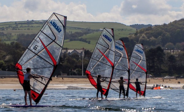 four windsurfers with SWA sails